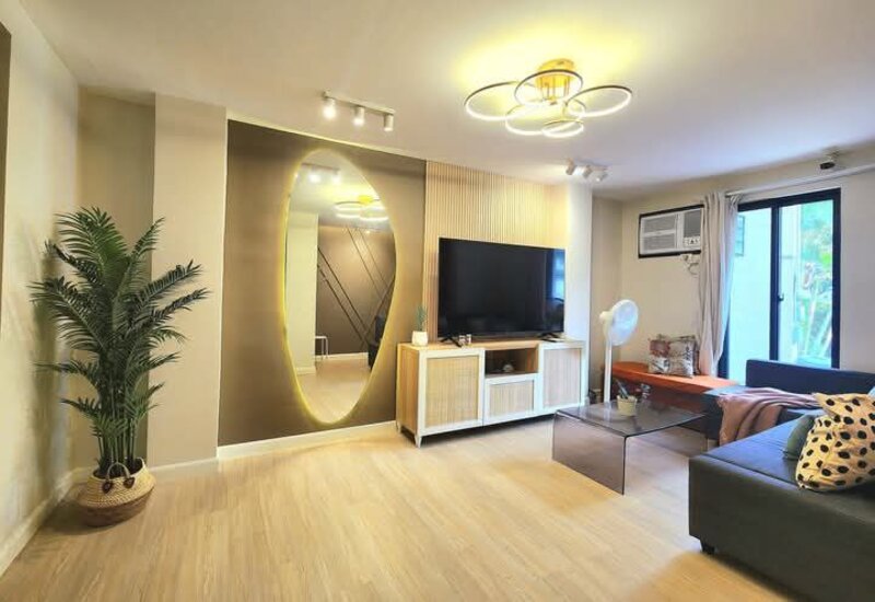 Living room wide angle view with wood flooring