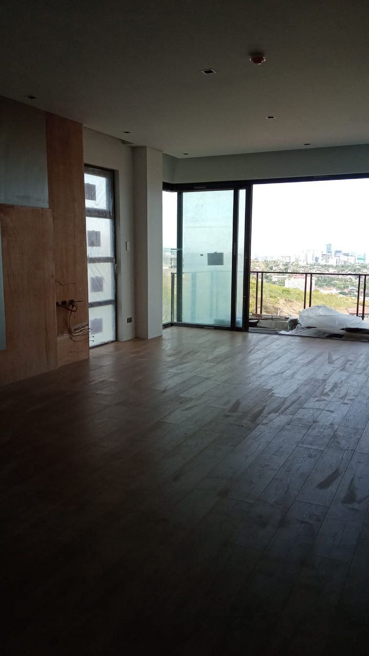 Condo wood flooring installation with city view